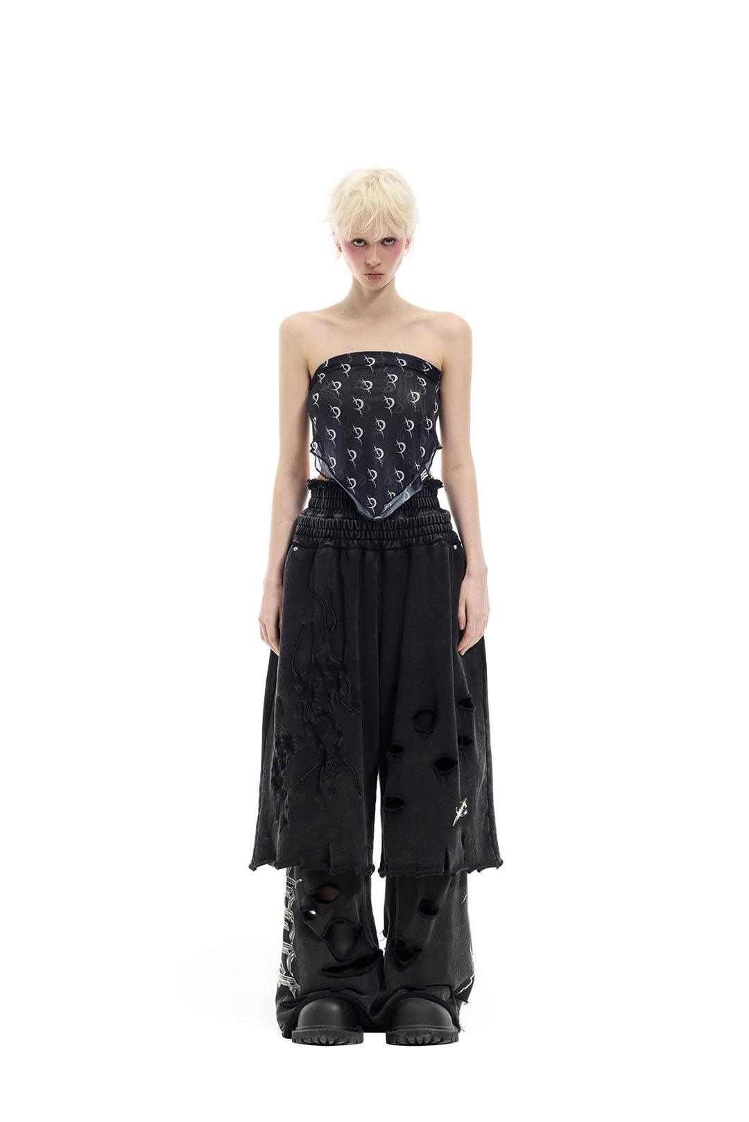 PINKSPINK ELECTRIC MOON distressed embroidered wide-leg shorts — black — full-length front view layered over trousers