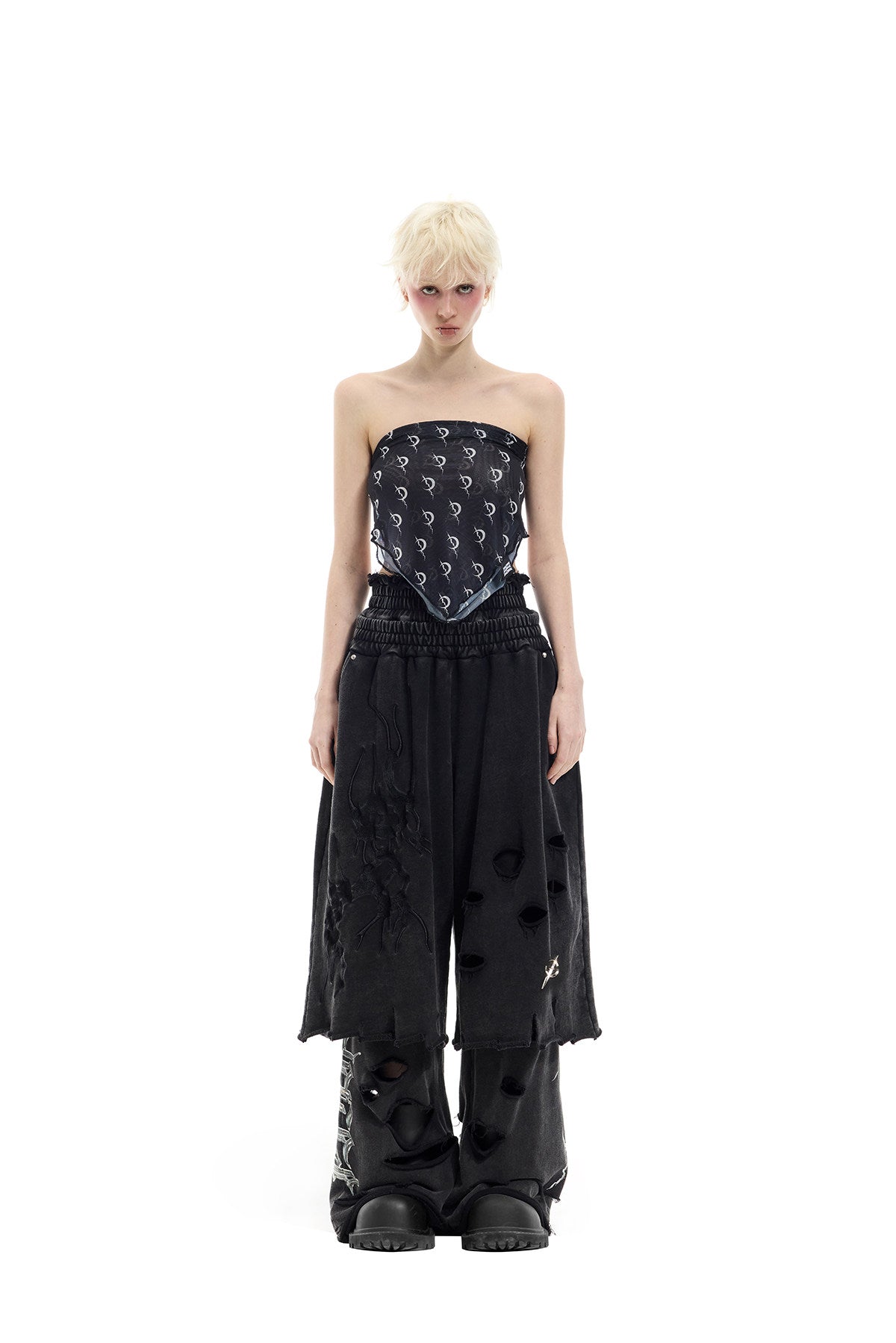 PINKSPINK ELECTRIC MOON distressed embroidered wide-leg shorts — black — full-length front view layered over trousers