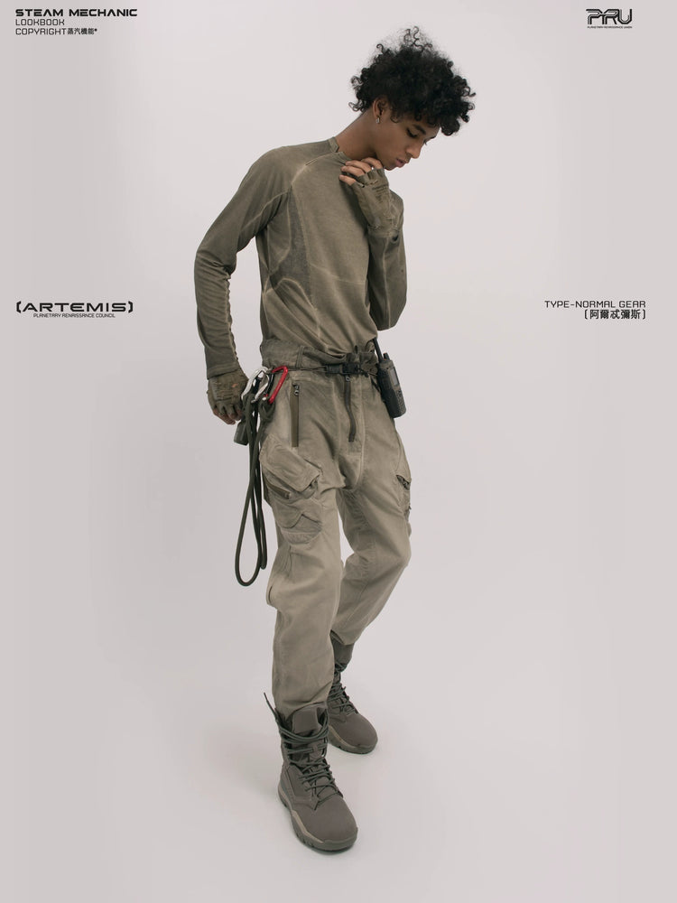 TWIN STAR lunar soil teal stretch riding base-layer top — rear modeled view