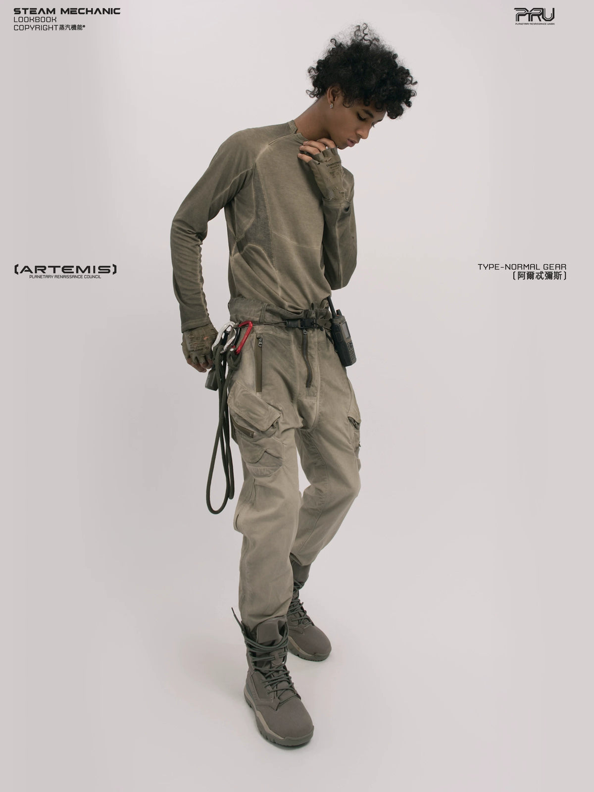 TWIN STAR lunar soil teal stretch riding base-layer top — rear modeled view