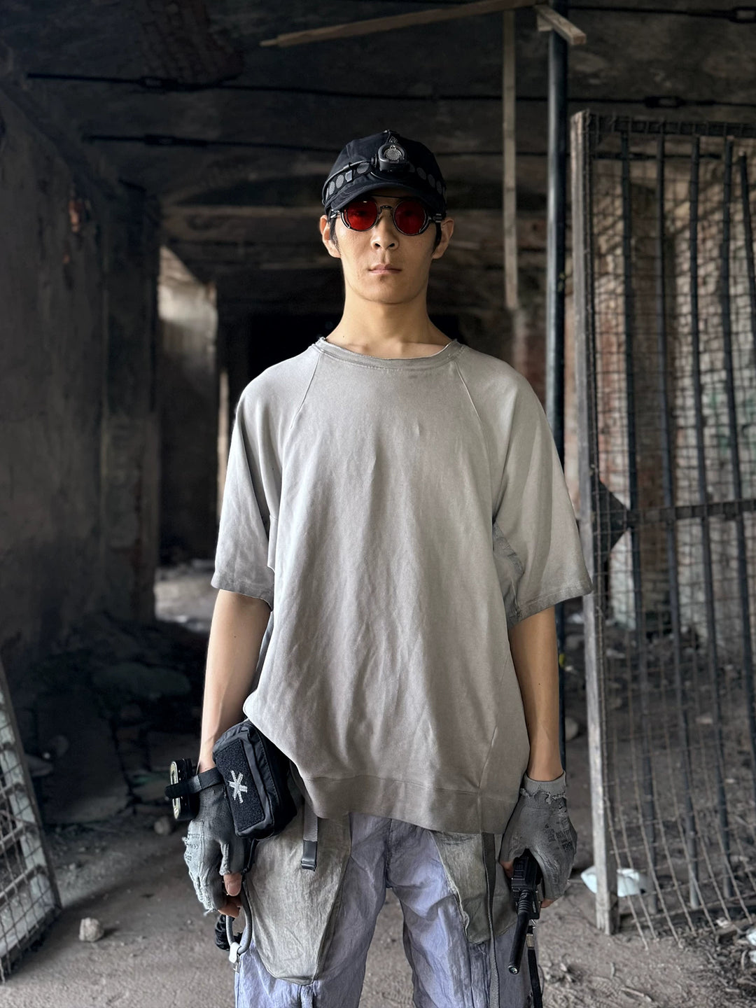 ERODED SPINE distressed asymmetric tee — front modeled product view