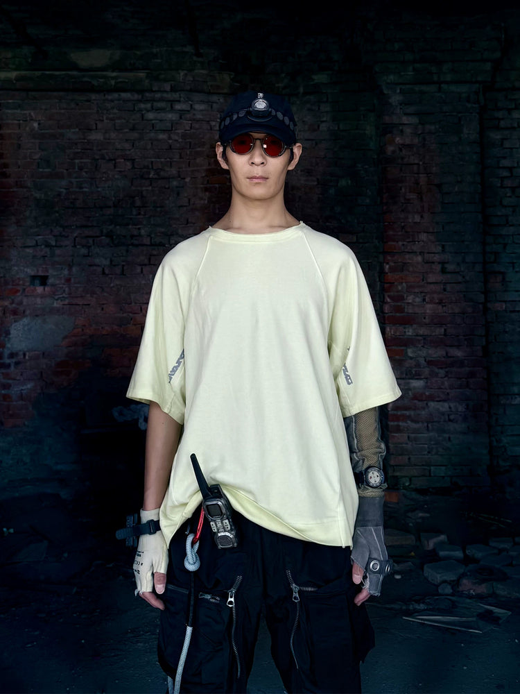 ERODED SPINE distressed asymmetric tee — alternate modeled angle