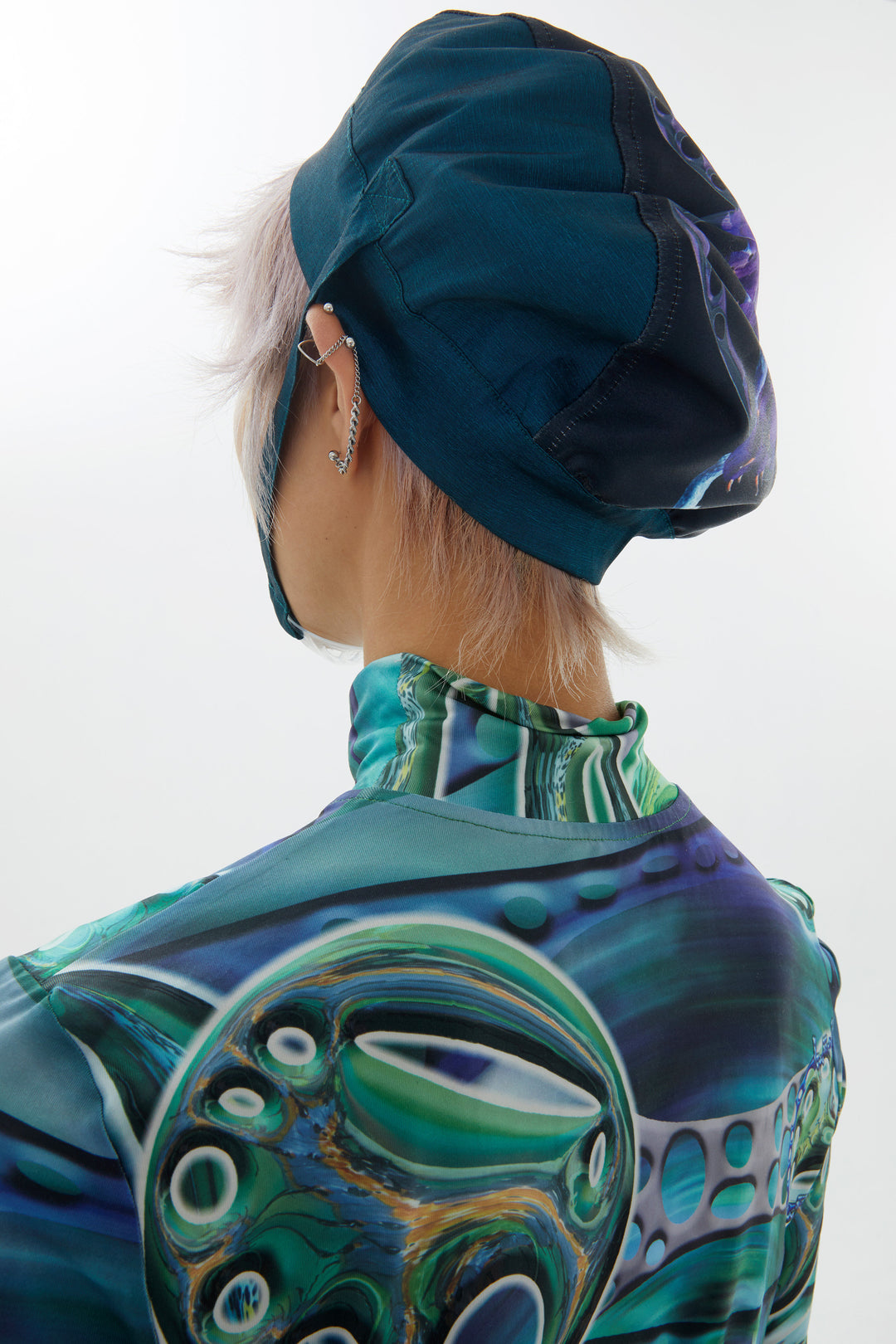 EMBRYO LARVA patchwork cycling cap — full-length modeled view
