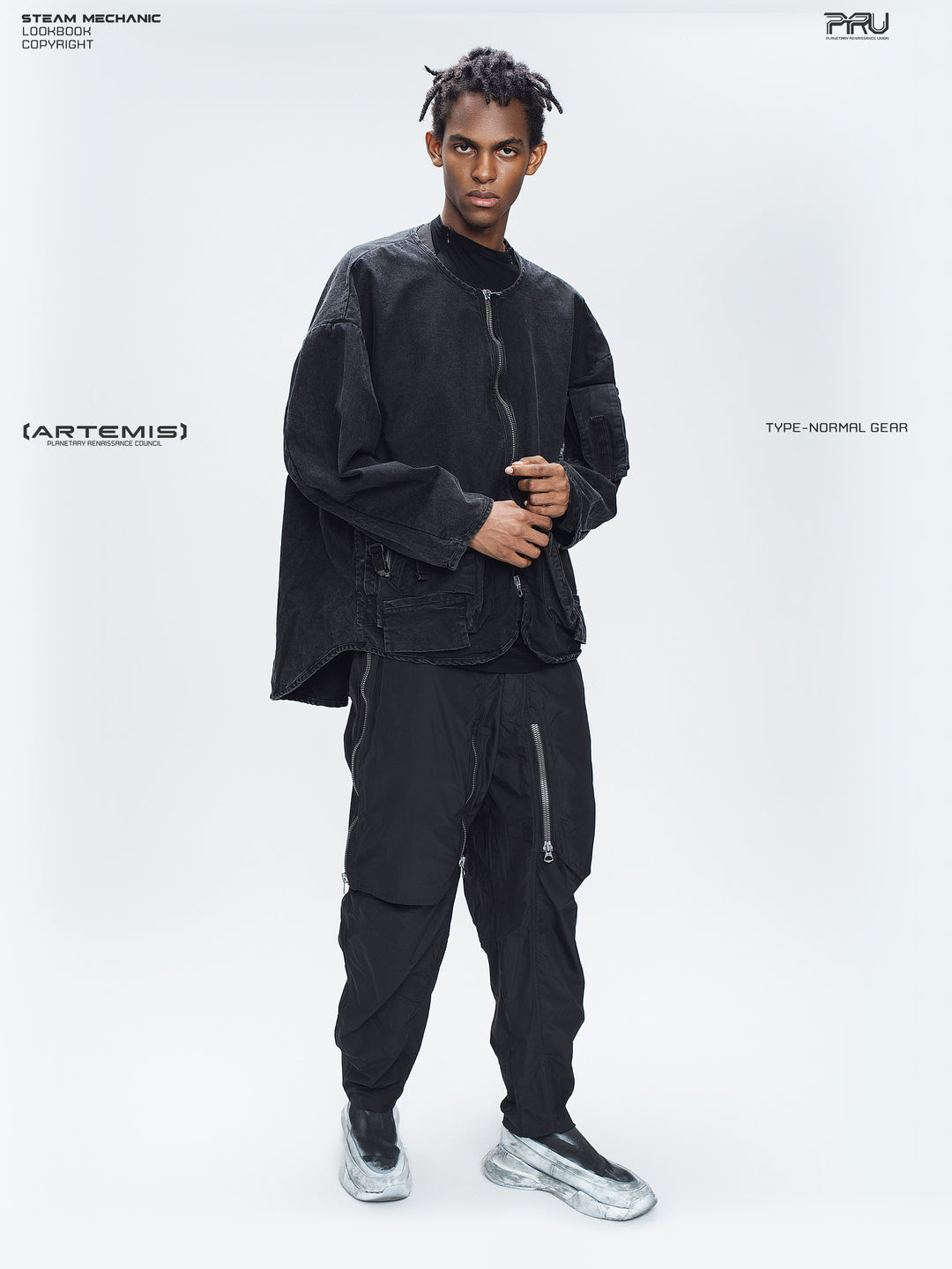 GAIA curved-blade technical pants in black — full-length three-quarter styling view with a matching zip jacket