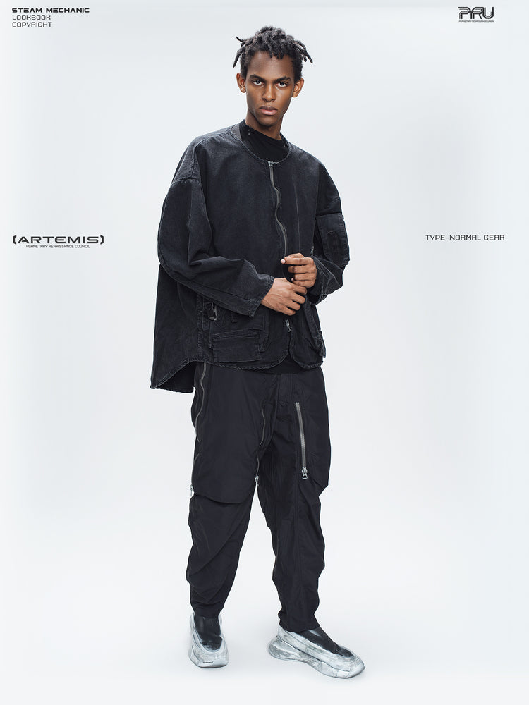 GAIA curved-blade technical pants in black — full-length three-quarter styling view with a matching zip jacket
