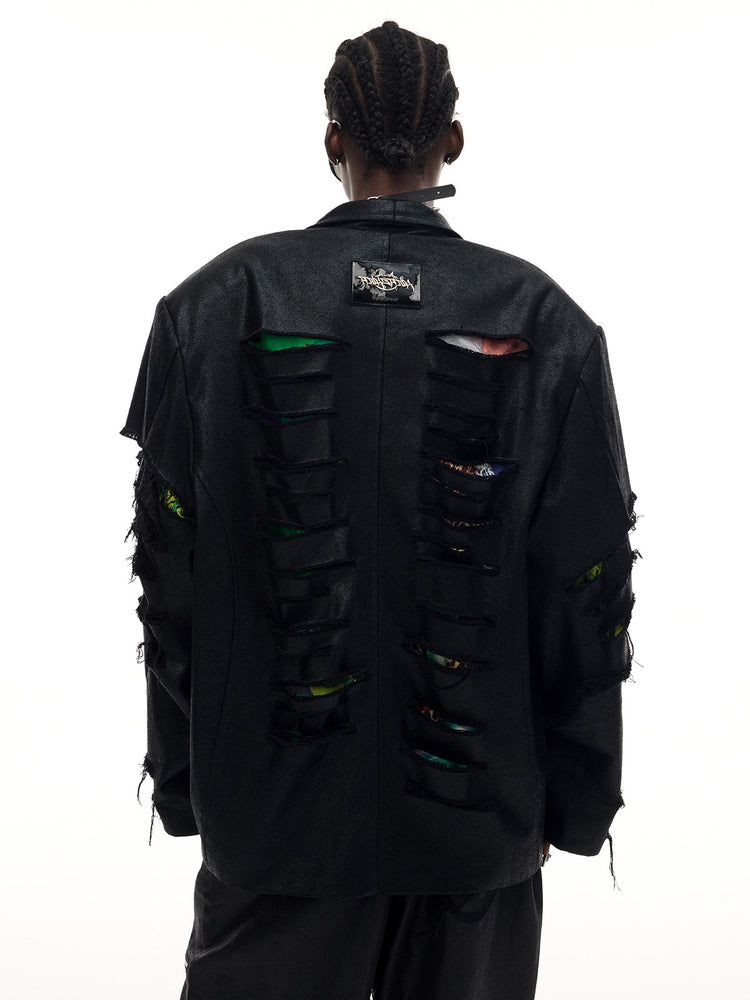 PINKSPINK BREACH distressed coated oversized blazer in black — close rear modeled view showing the symmetrical rows of slashes