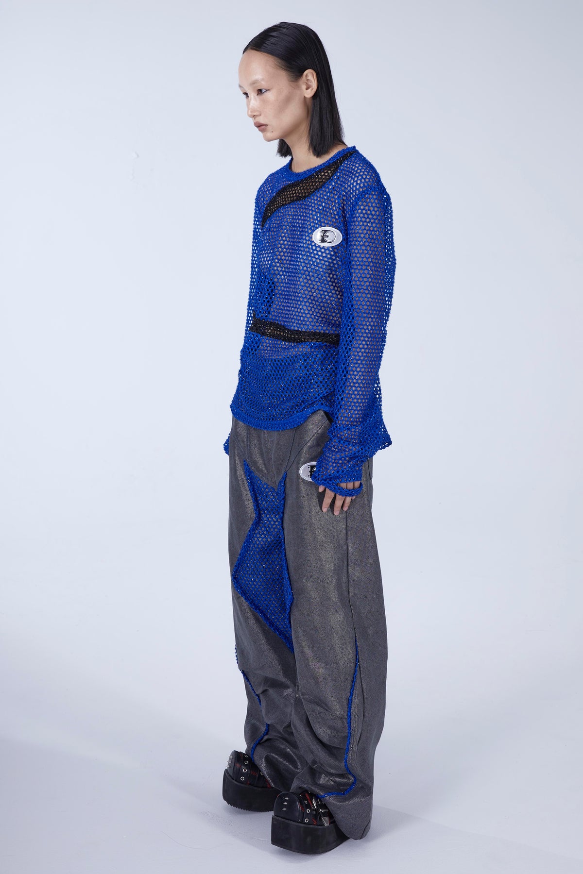 EMBRYO BLUE VOID cutout mesh finger-sleeve top — alternate modeled angle