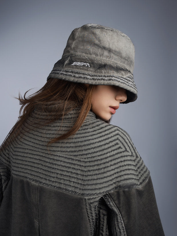 PIONEER distressed nylon bucket hat — moon dust gray over-shoulder modeled view