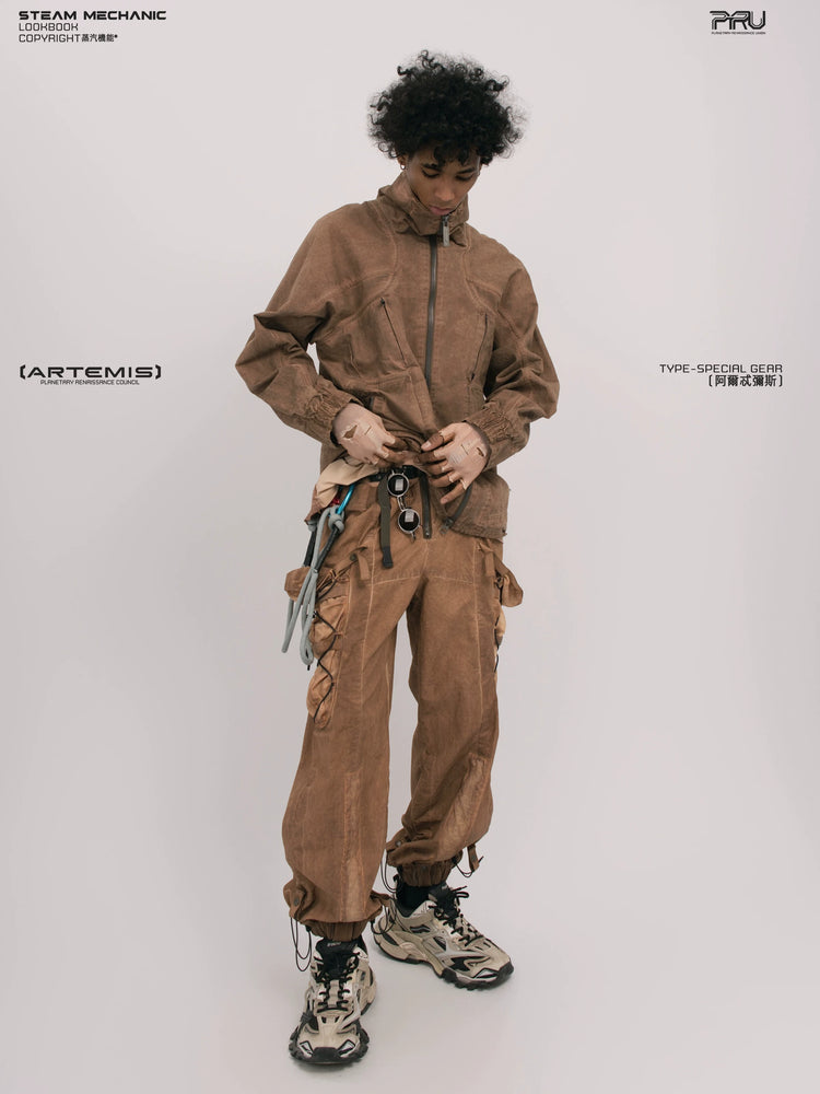 ARTEMIS soft dawn orange tuck-paneled technical jacket — material and silhouette detail