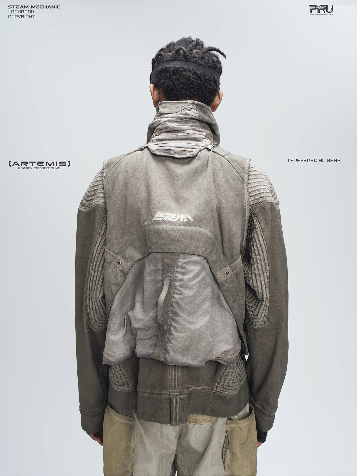 FISSION modular vest in mercury brown — close modeled back view showing the detachable rear pouch