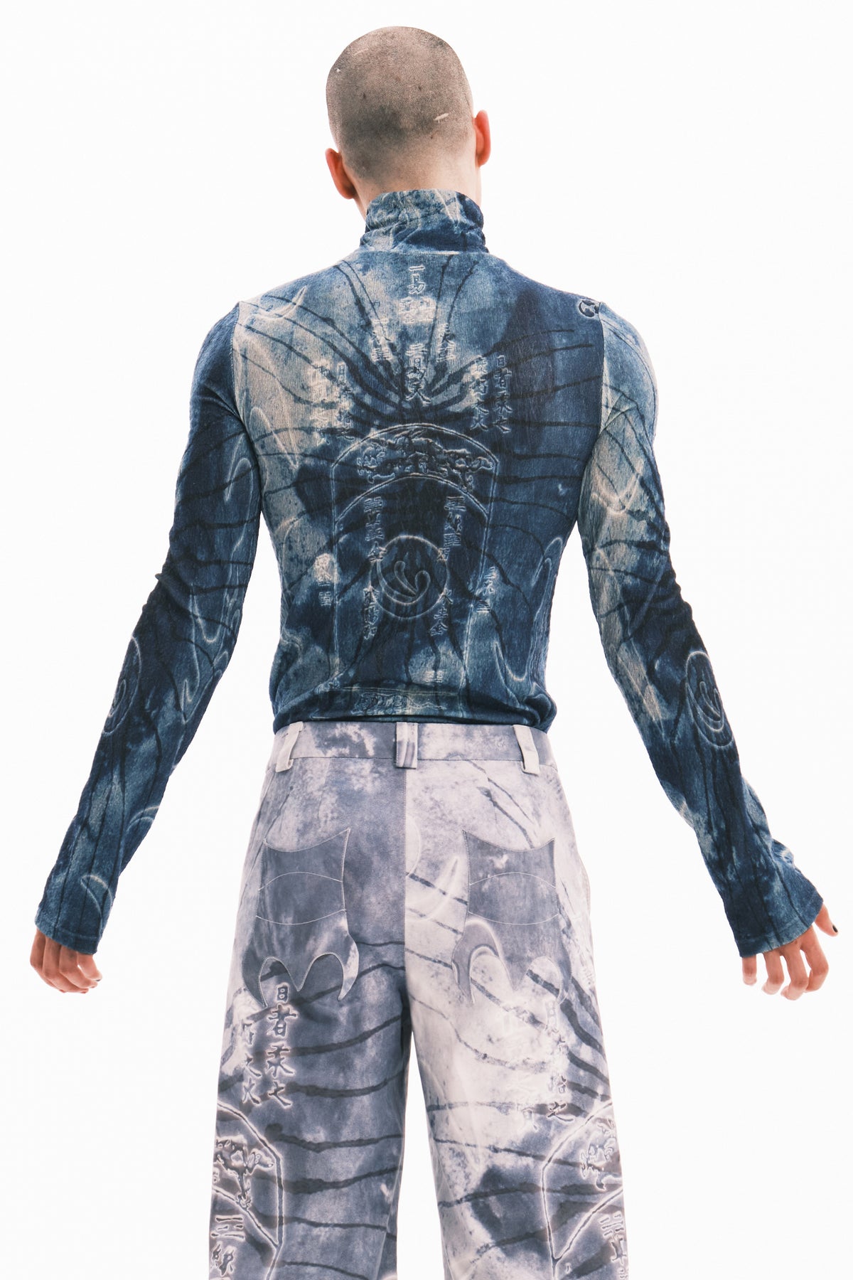 EMBRYO ANCIENT CODE textured mock-neck top — garment-only construction view