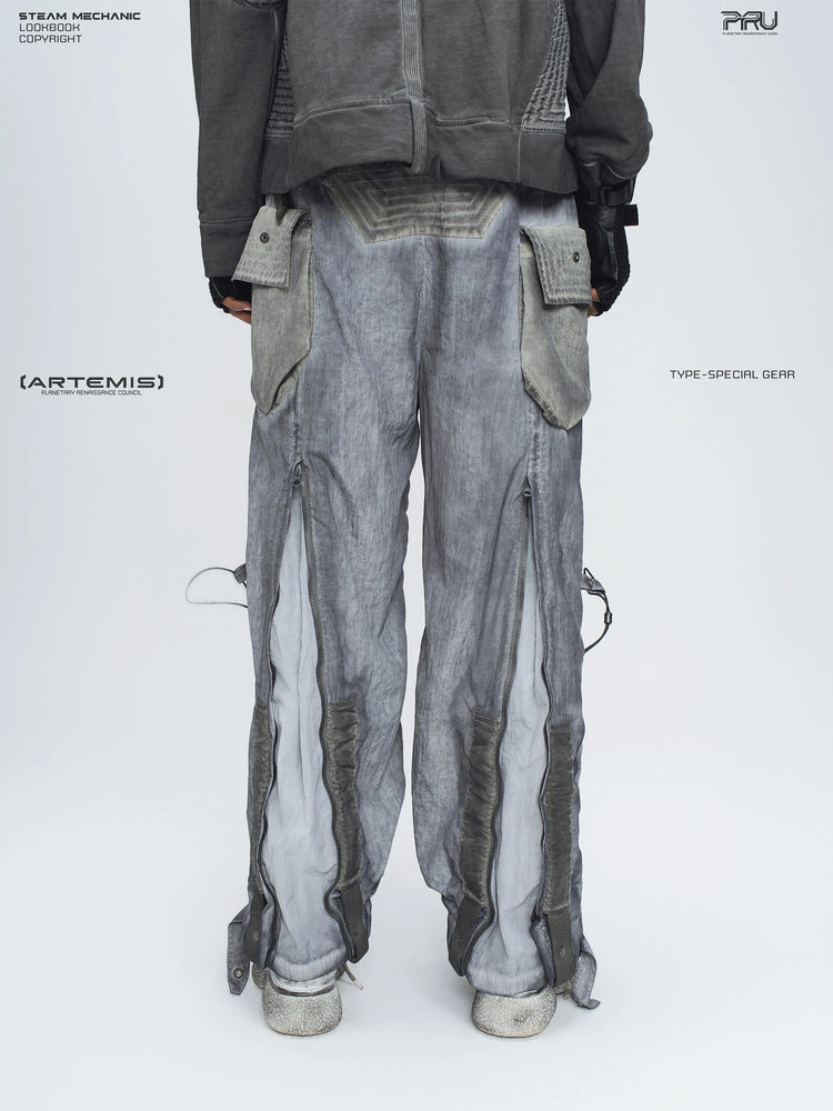 STARCORE moon dust gray engineer utility pants — back modeled view showing the opened leg panels