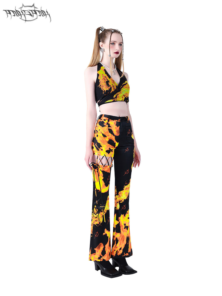 PINKSPINK FLAME halter crop top — black three-quarter front view showing the crossover hem