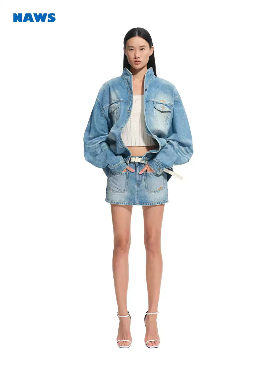 NAWS VOLCANO washed denim stand-collar jacket — close modeled view highlighting the construction