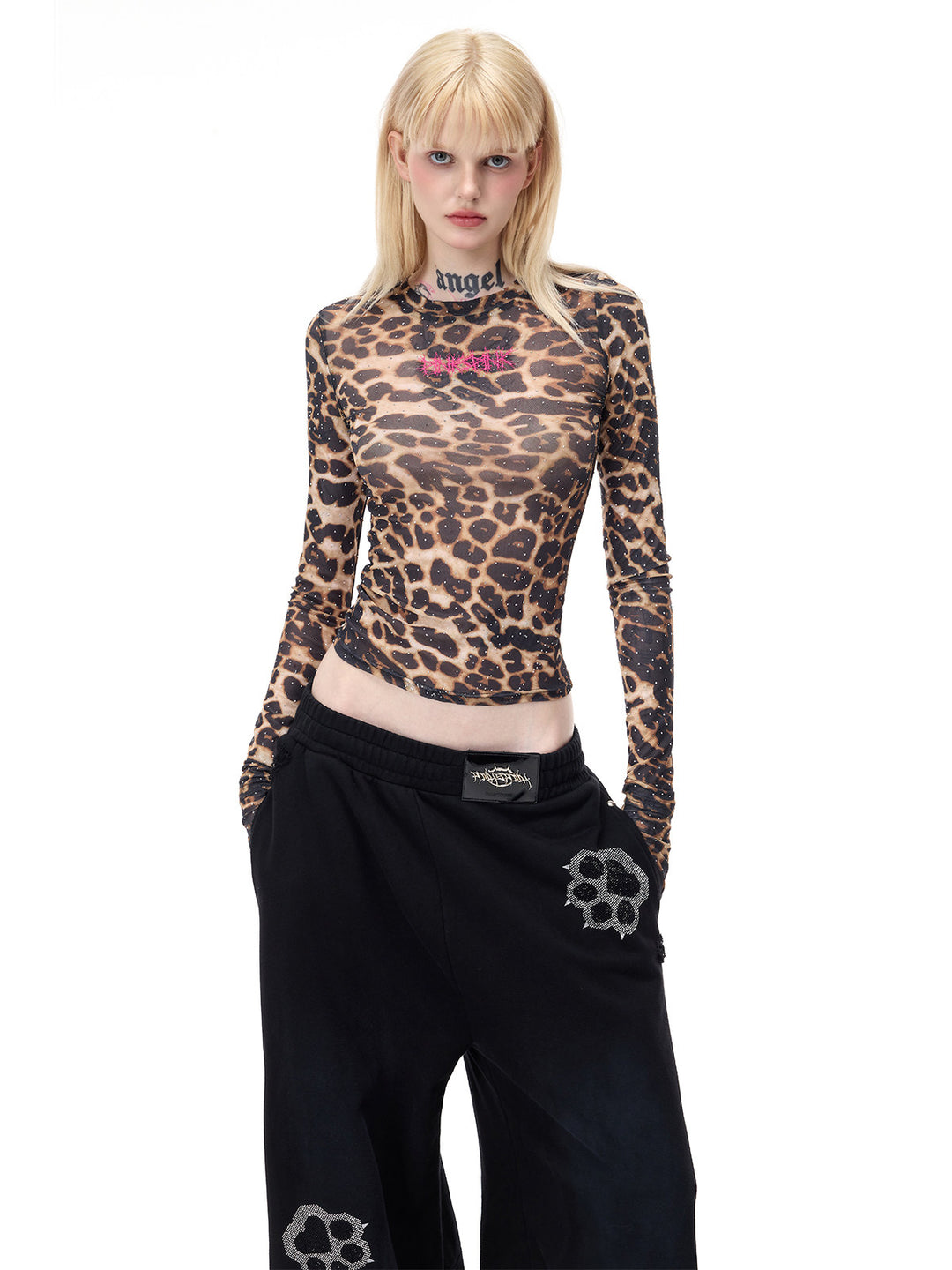 PINKSPINK VENOM rhinestone leopard mesh tee in brown leopard — closer front modeled pose with hand in pocket