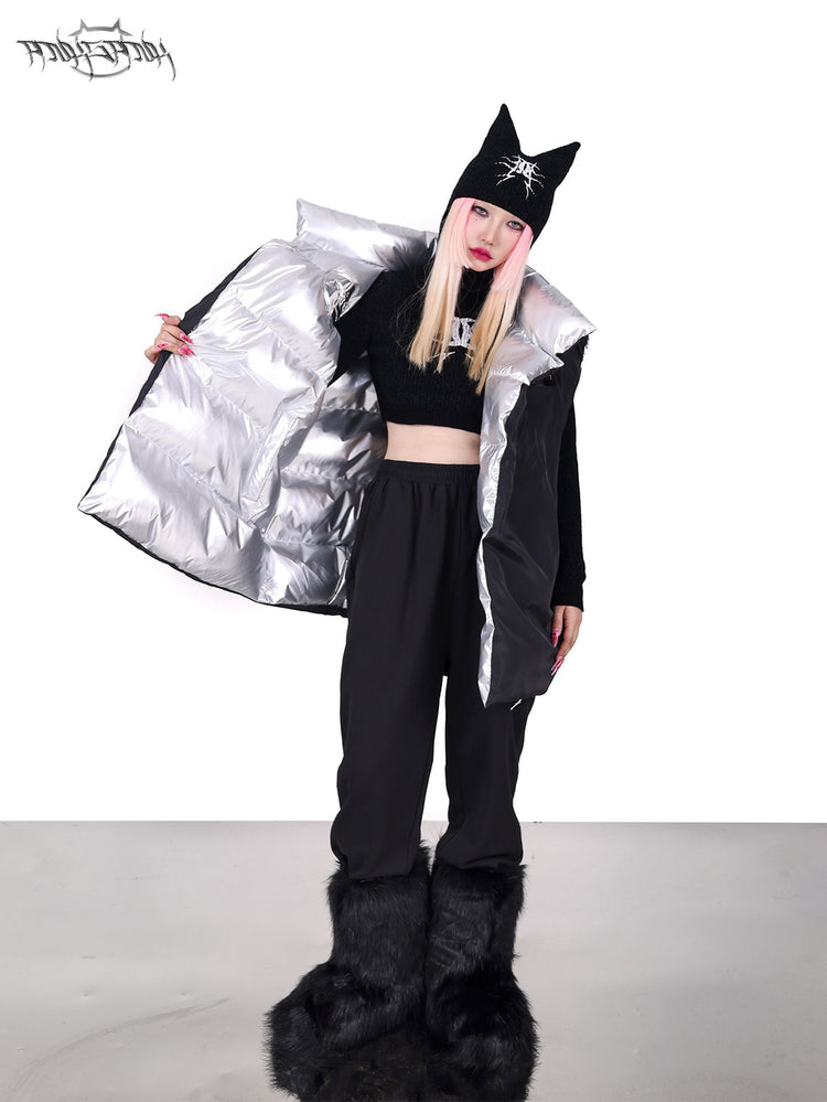 PINKSPINK ORBIT reversible padded vest in black silver — black-side modeled view held open to reveal the silver reverse