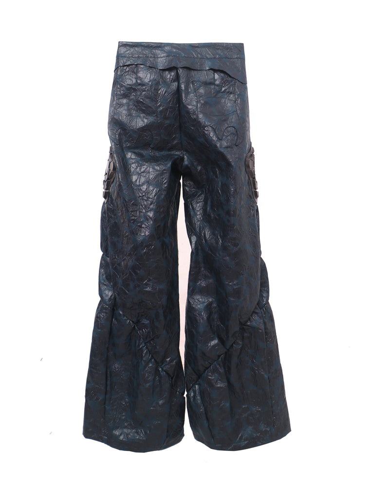 EMBRYO GUARD SHELL ruched PU leather flare pants — rear modeled view