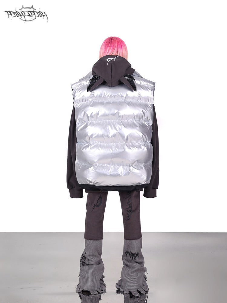 PINKSPINK ORBIT reversible padded vest in black silver — silver-side rear modeled view layered over a gray hoodie