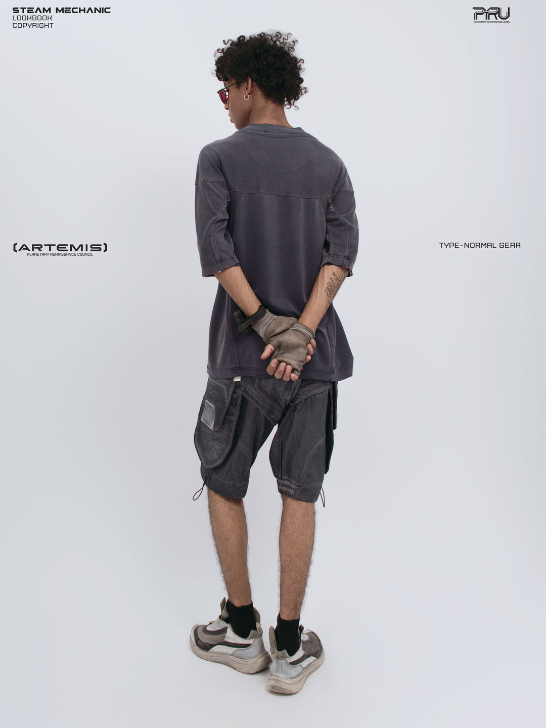 LIGHTSHADOW spirit deconstructed technical tee — full-length rear three-quarter view with clasped hands