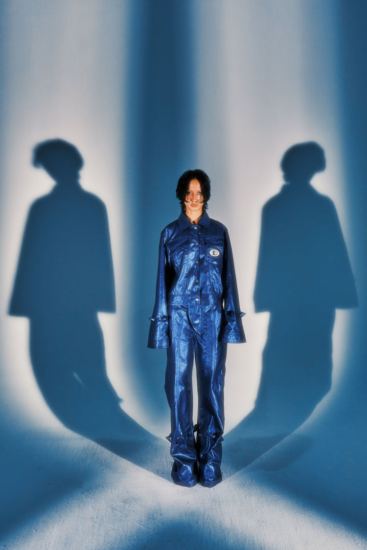 EMBRYO BLUE SPIKE metallic flare pants — rear modeled view