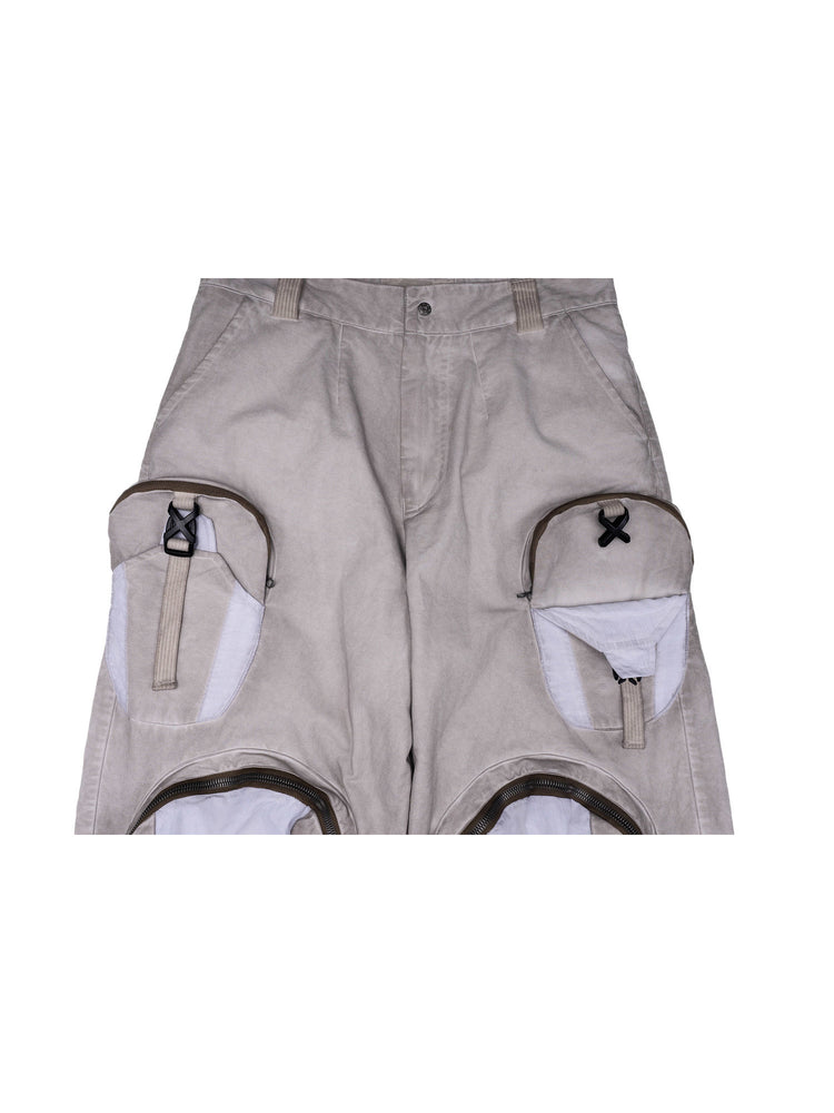 PIONEER eris white welded multi-pocket work pants — garment detail showing a folded thigh pouch and adjustable buckle strap