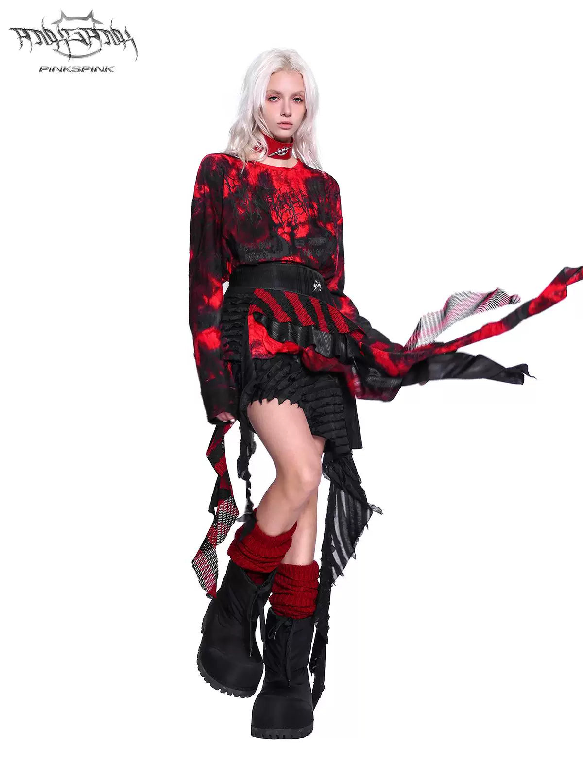 PINKSPINK ELECTRIC MOON layered striped mesh mini skirt — black and red — raised-leg pose showing flowing asymmetric panels