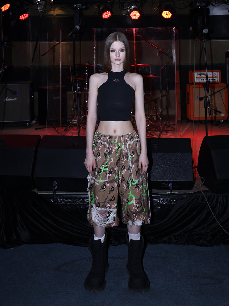 PINKSPINK ELECTRIC MOON distressed camo cropped trousers in CAMOUFLAGE — full front with halter top.