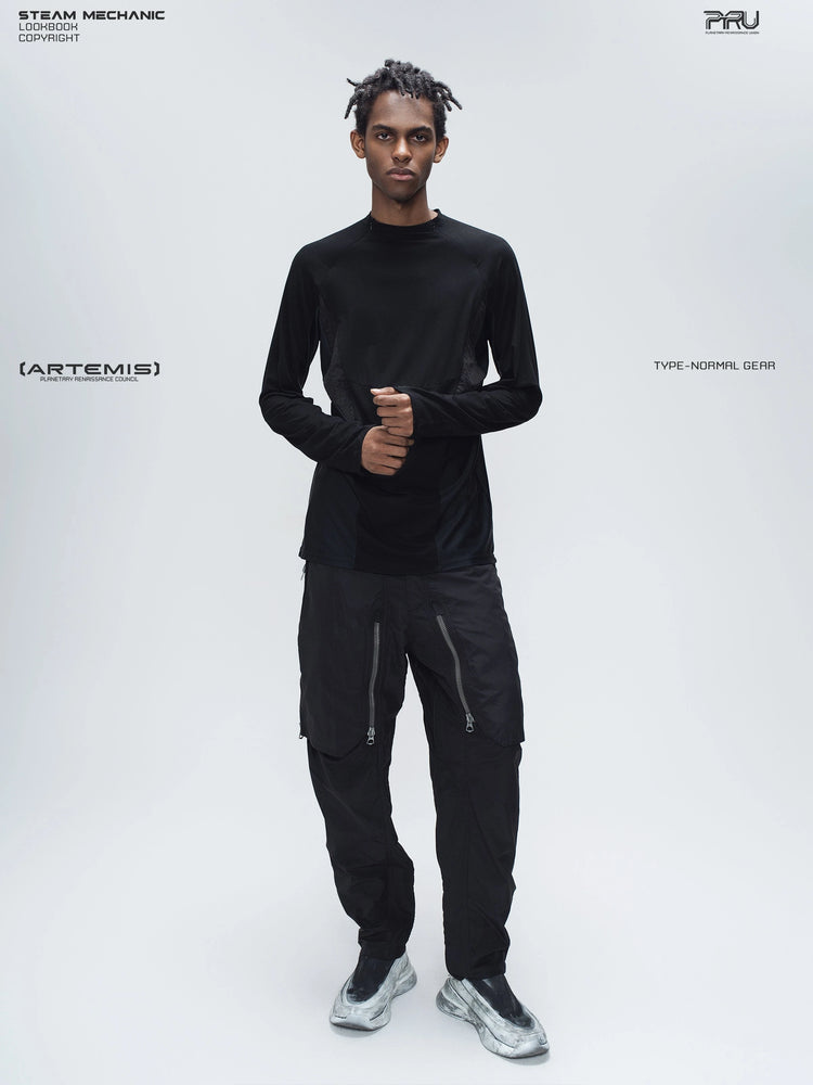 ARTEMIS stardust black stretch technical base-layer top — full-length modeled view showing the top worn over technical trousers