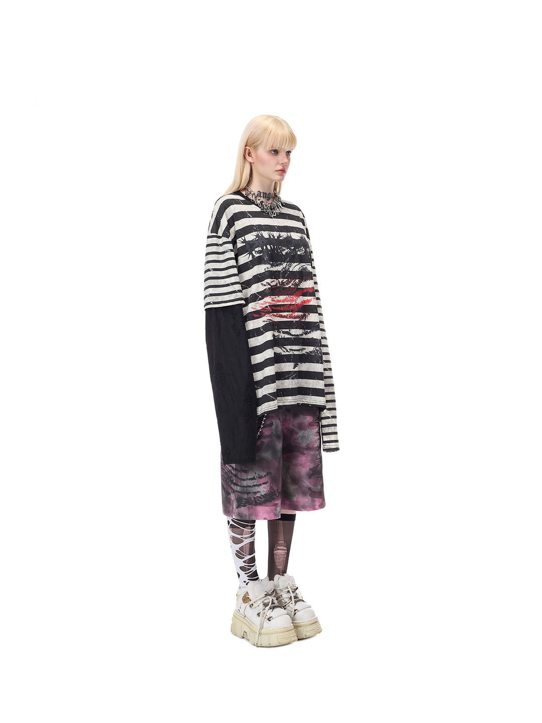 PINKSPINK STATIC asymmetric striped burnout long-sleeve tee in black and white — full-length opposite-side modeled view showing the contrasting black sleeve