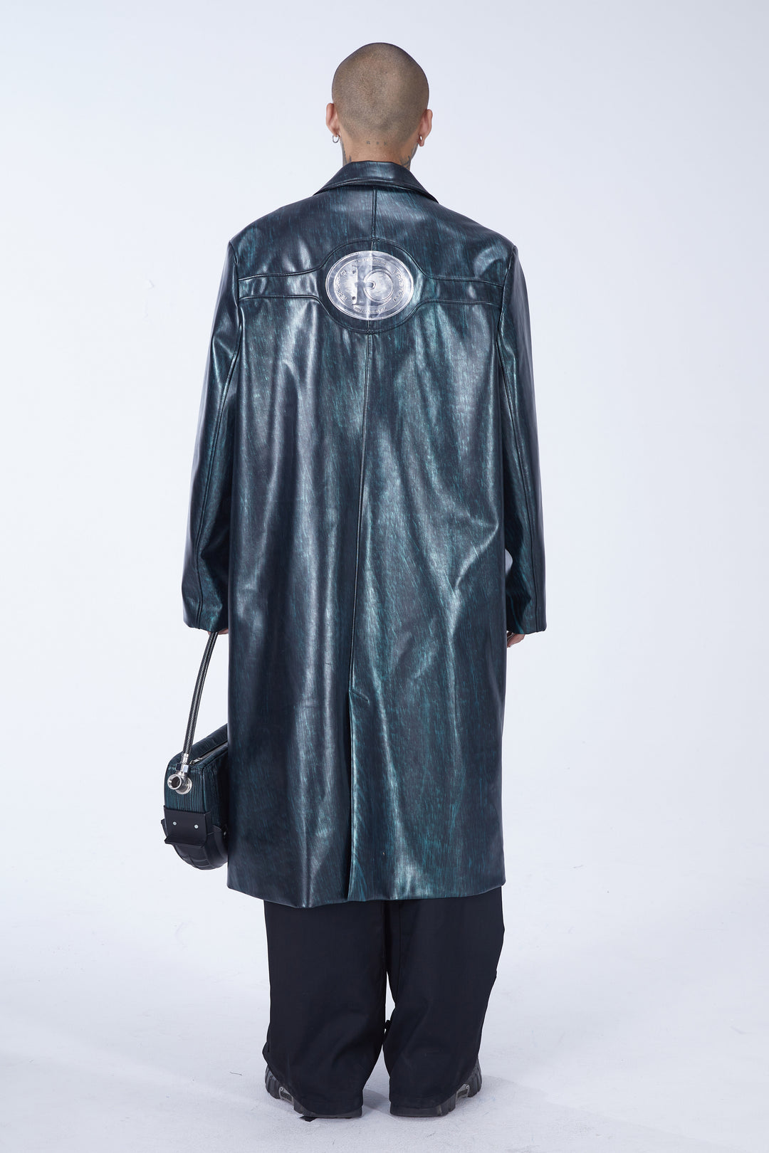 EMBRYO MATRIX buckle PU leather trench coat — construction and silhouette detail