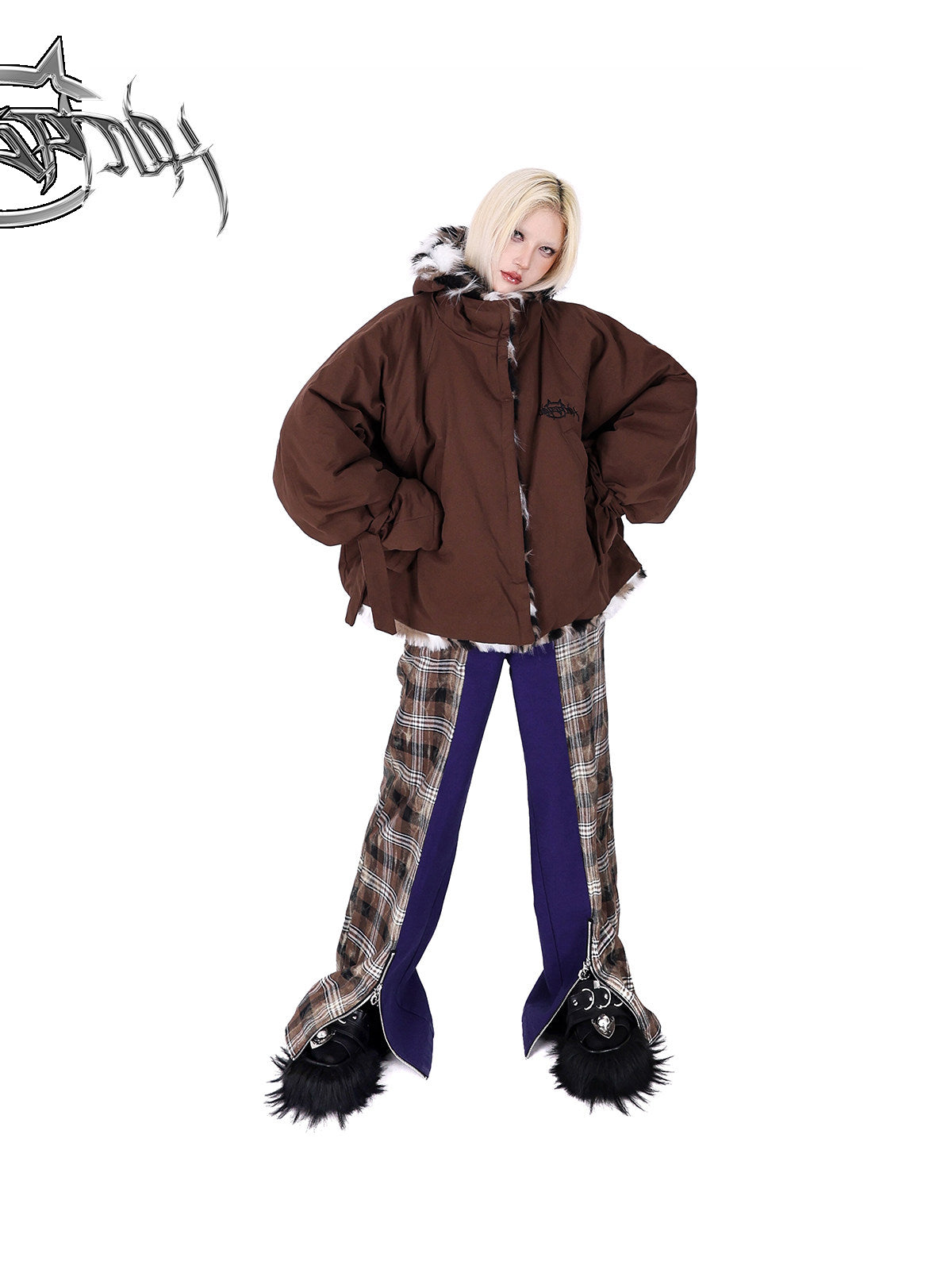 PINKSPINK DNA purple plaid split-panel wide-leg pants — front full-length modeled view styled with a brown padded jacket