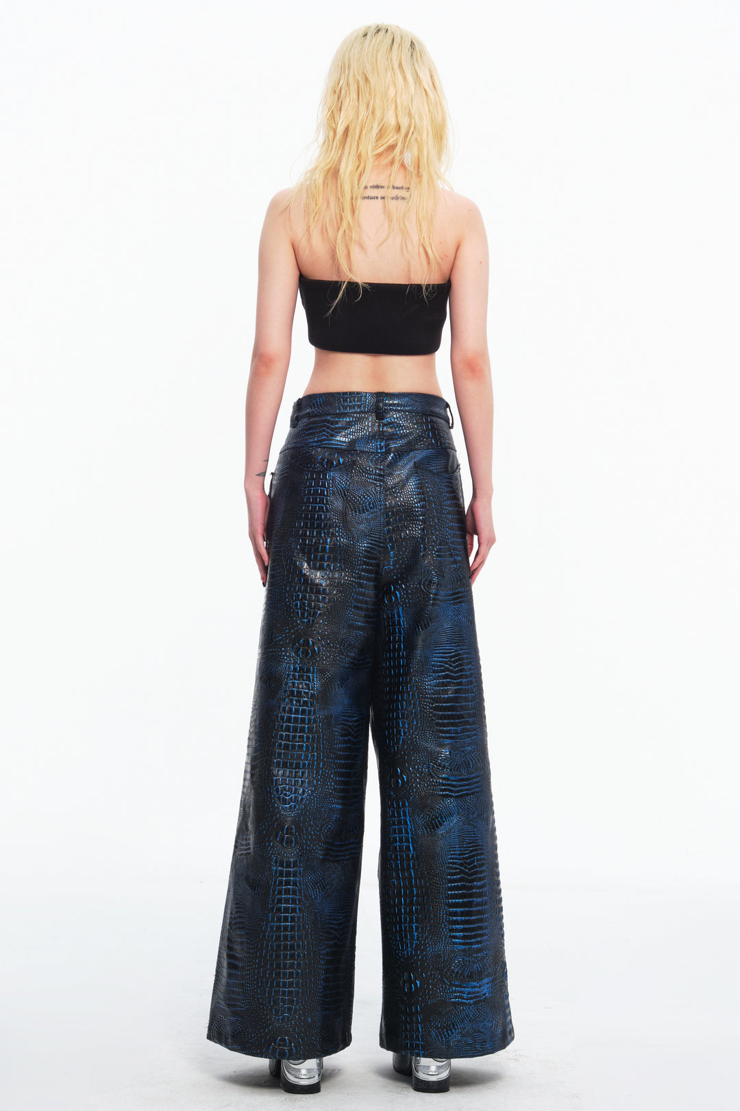EMBRYO CLAW ARMOR crocodile-effect wide-leg pants — construction and silhouette detail