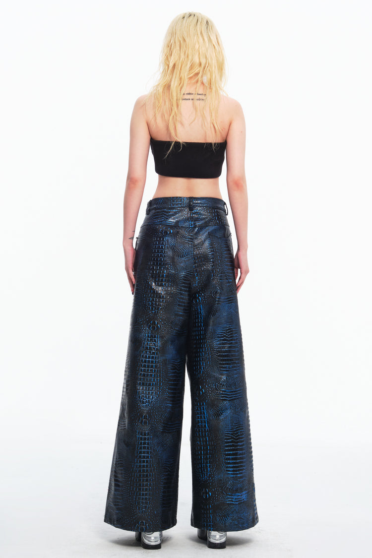 EMBRYO CLAW ARMOR crocodile-effect wide-leg pants — construction and silhouette detail