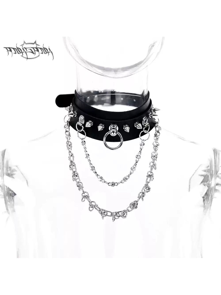 PINKSPINK SPIKE RING studded chain choker in black — front product-only view on the original clear acrylic display