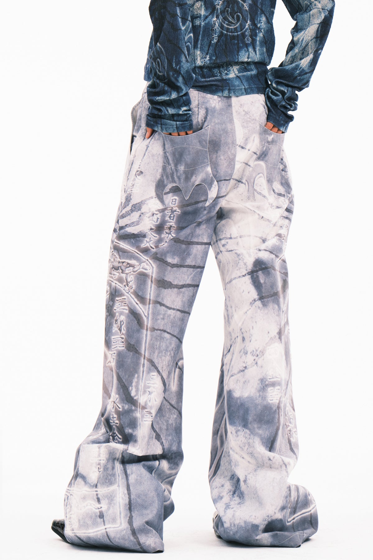 EMBRYO ANCIENT CODE coated wide-leg pants — product-only rear view