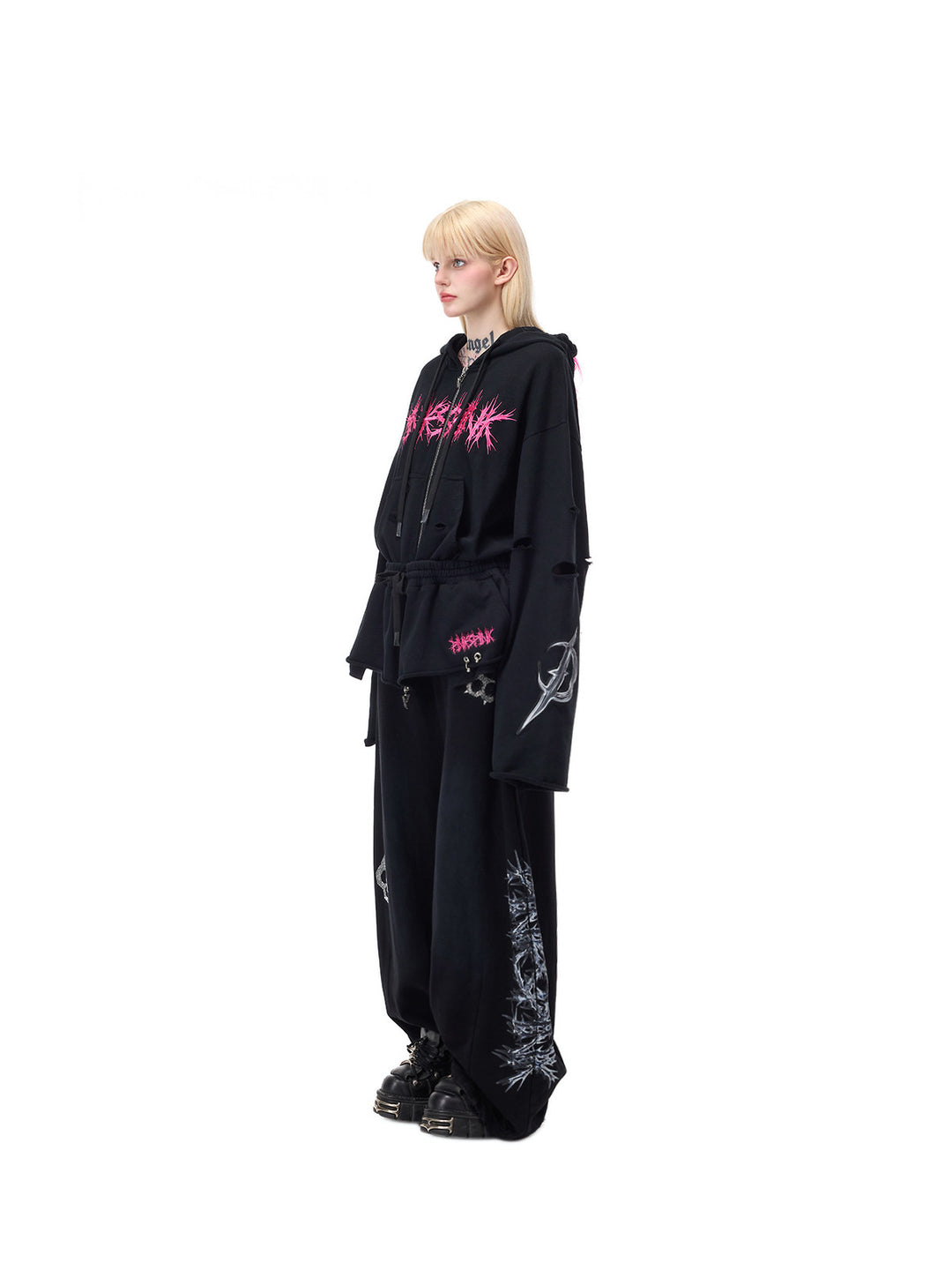 PINKSPINK MOHAWK RITUAL studded zip-up hoodie — side full-length styling with black pants