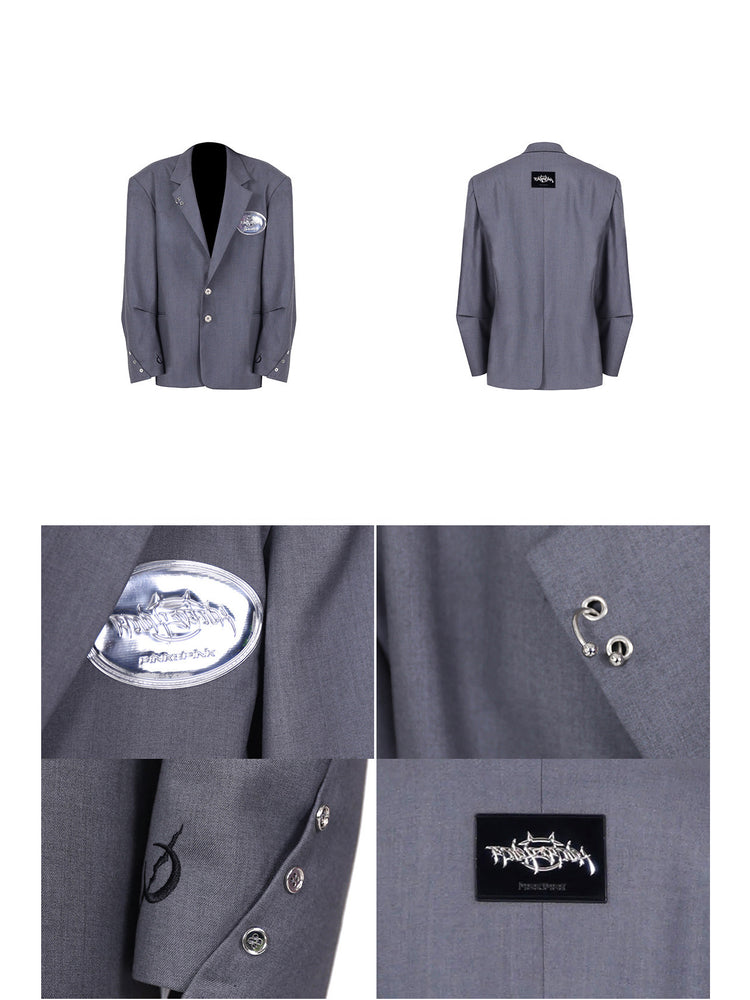 PINKSPINK REBEL pierced oversized tailored blazer in gray — front and back garment views with close-ups of lapel rings, chest emblem and cuffs