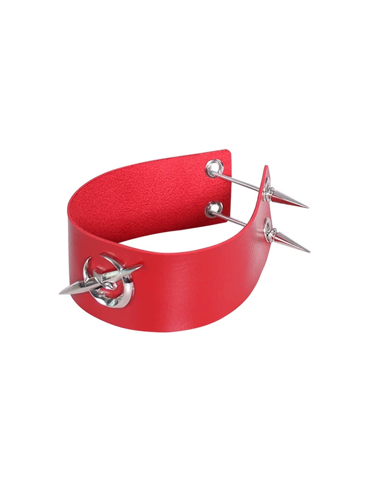 PINKSPINK ELECTRIC MOON punk leather choker — red leather choker with silver-tone spikes and eyelets, angled product-only view