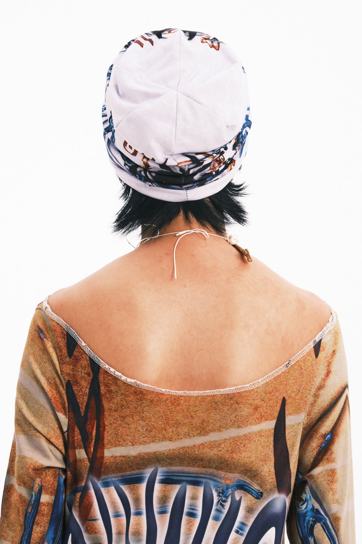 EMBRYO TRIBAL ENTITY graphic slouch beanie — material and hardware detail