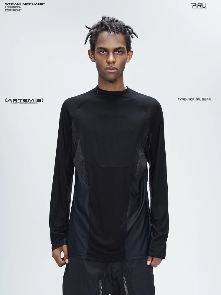 ARTEMIS stardust black stretch technical base-layer top — front modeled view showing the curved chest seam and contrasting side panels
