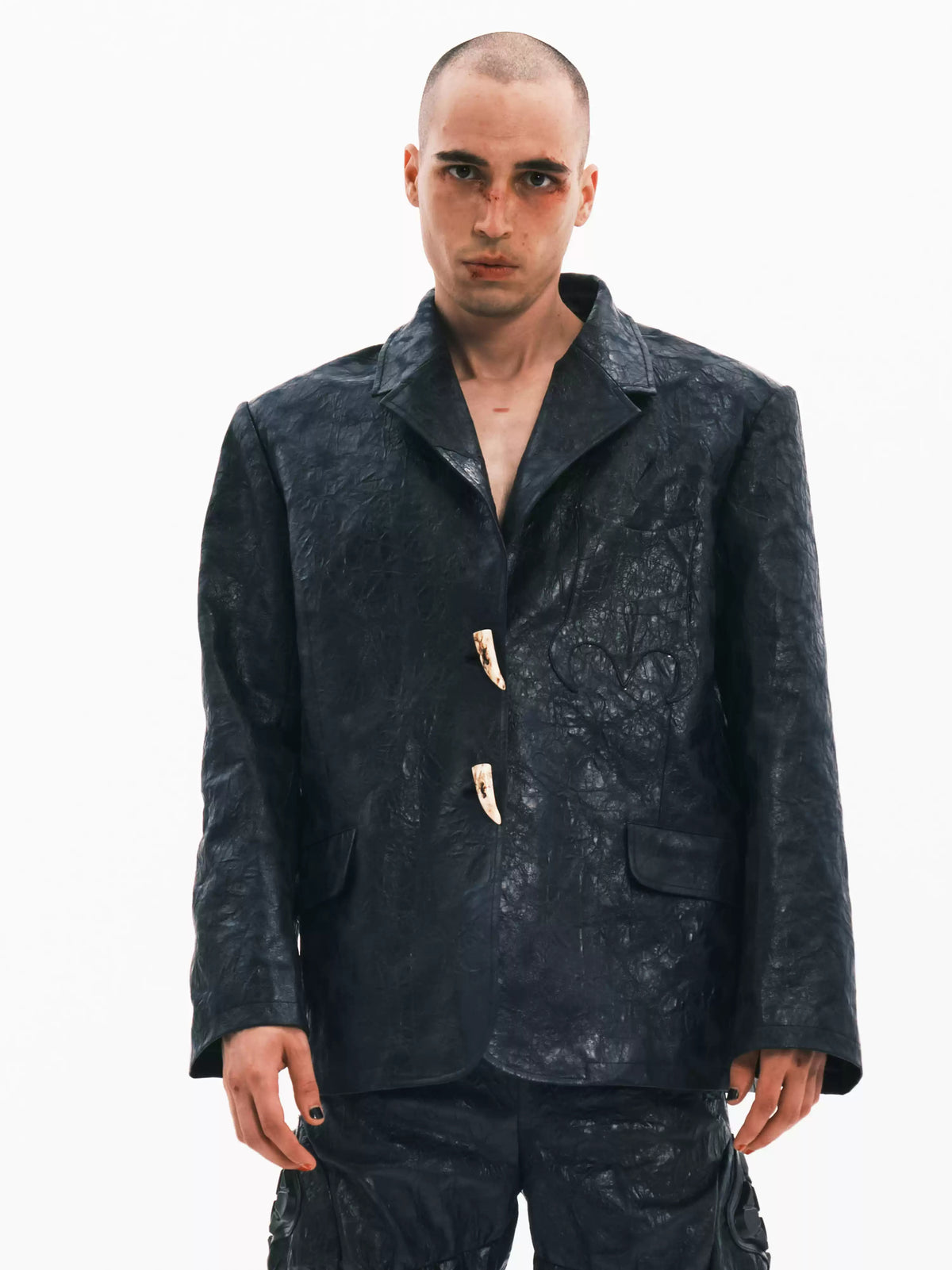 EMBRYO HORN CODE textured PU leather blazer — front modeled view