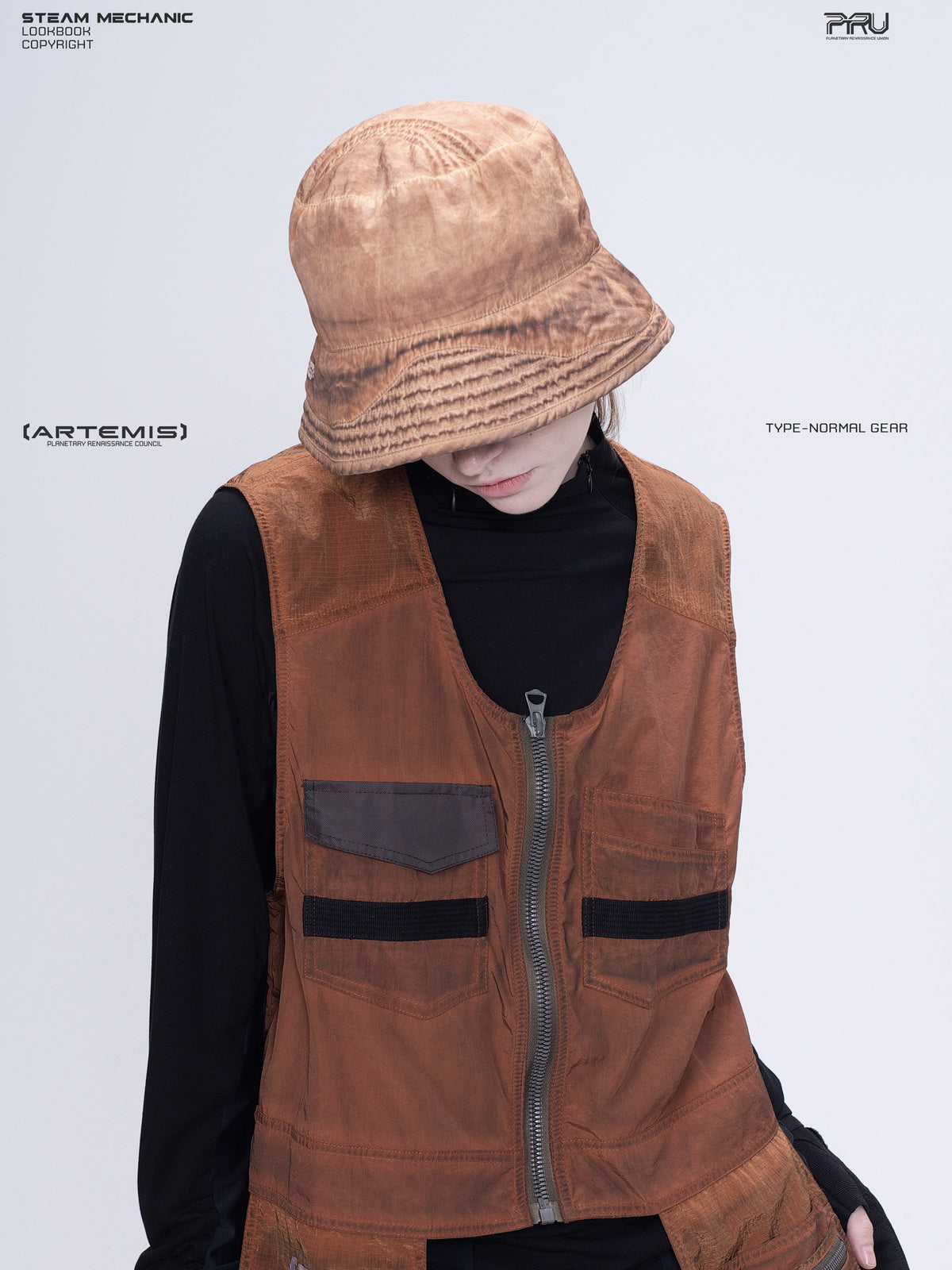 PIONEER venus orange distressed nylon bucket hat — downward-facing portrait showing the crown seams