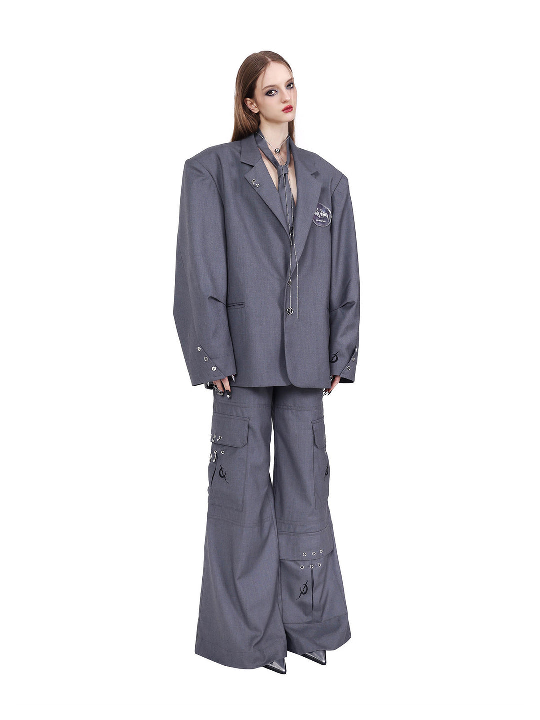 PINKSPINK ELECTRIC MOON ring-detail cargo flare trousers in gray — angled front view showing the embroidered pocket emblems below a separate blazer