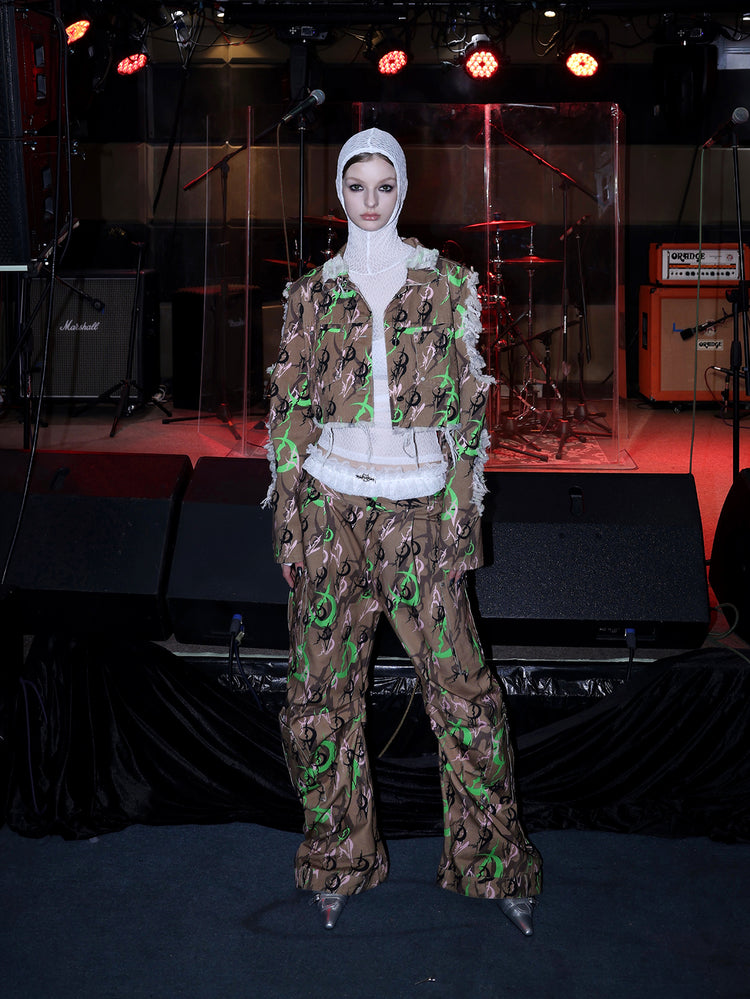 PINKSPINK ELECTRIC MOON sculpted camo cargo trousers in CAMOUFLAGE — wide-stance full front with white hood.