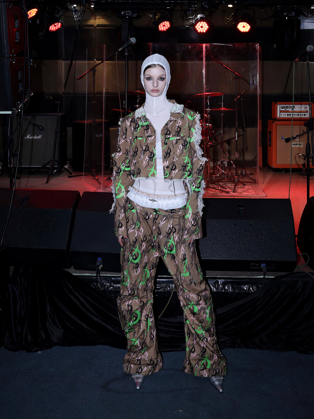 PINKSPINK ELECTRIC MOON distressed camo cropped jacket in CAMOUFLAGE — full-body front view styled with a white mesh hood.
