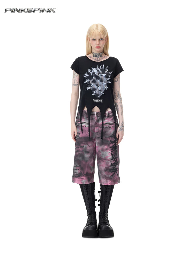 PINKSPINK PUNK CACTUS studded pointed-hem tee in black — full-length front modeled view with the studded pointed hem over separate pink camouflage shorts
