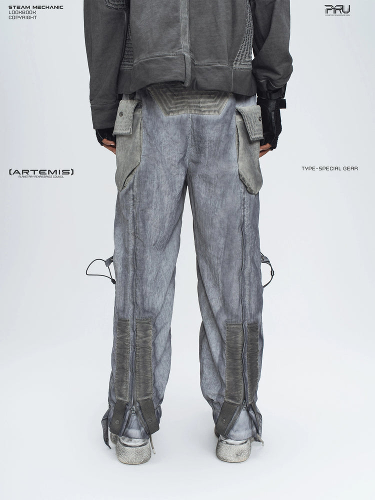 STARCORE moon dust gray engineer utility pants — back lower-body modeled view with the leg zippers closed