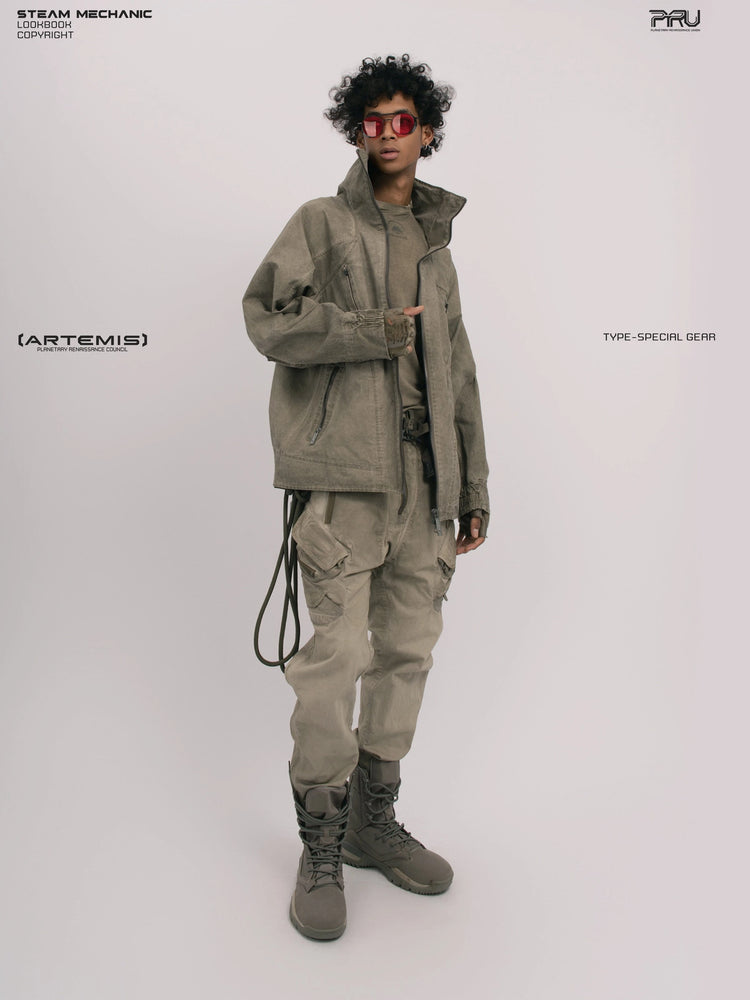 ARTEMIS xirang brown tuck-paneled technical jacket — full-length three-quarter modeled view with a hand at the front zipper