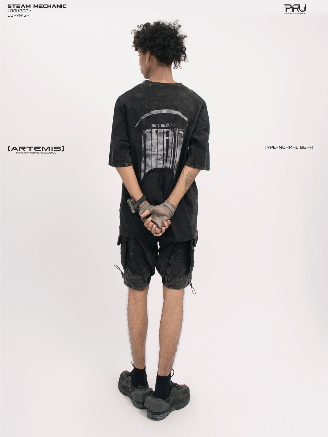 STARCORE black tortoise velcro mesh tee — full-length rear modeled view with hands clasped