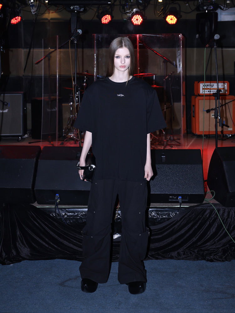 PINKSPINK METAL LOGO padded-shoulder oversized tee — alternate modeled styling view